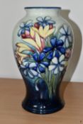 A MOORCROFT POTTERY 'SPRING FLOWERS' PATTERN VASE, of baluster form, tube lined with colourful