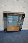 A MID CENTURY TEAK EFFECT DISPLAY CABINET, with two mirror panes, flanking double glass sliding