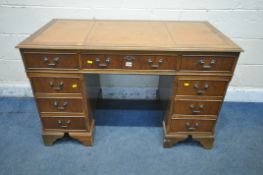A 20TH CENTURY YEW WOOD TWIN PEDESTAL DESK, with leather writing surface, fitted with nine