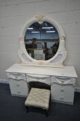 A CREAM ITALIAN DRESSING TABLE, fitted with seven assorted drawers, length 141cm x depth 56cm x