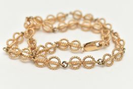 A 9CT GOLD FANCY LINK CHAIN, rope twist open work links, fitted with a lobster clasp, part Sheffield
