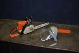 A STIHL MS210 PETROL CHAIN SAW with 13in blade and face mask (engine pulls freely but hasn't been