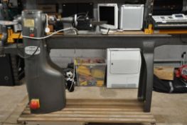 A UNION GRADUATE WOODWORKING LATHE by T.S. Harrison with bowl turning extension table and tool rest,