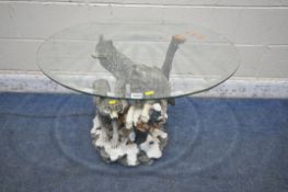 A WOLF THEMED COFFEE TABLE, with a circular bevelled glass top, diameter 80cm x depth 57cm (