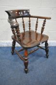 A 20TH CENTURY ELM AND BEECH BOW TOP CAPTAINS CHAIR, with shaped armrests, spindle supports,
