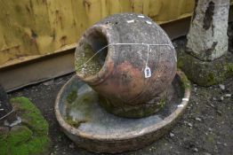 A COMPOSITE GARDEN FEATURE, of a urn within an oval bowl (condition report: weathered, some chips)