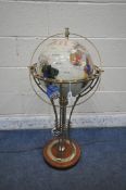 A FLOOR STANDING GEMSTONE GLOBE LAMP, raised on a shaped support and wooden base, height