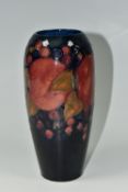 A MOORCROFT POTTERY 'POMEGRANATE' PATTERN VASE, of elongated ovoid form, tube lined with