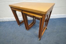 A.H. MCINTOSH, A MID CENTURY TRIFORM NEST OF TABLES, the largest table with a folding revolving top,