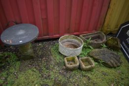 A SLATE TOP GARDEN TABLE, on a composite base, diameter 57cm x height 55cm, along with a weathered