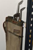A GROUP OF VINTAGE GOLF CLUBS AND TROLLEY, comprising a leather trimmed canvas golf bag, a hickory
