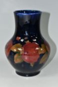 A MOORCROFT POTTERY 'POMEGRANATE' PATTERN VASE, of baluster form, tube lined with pomegranates,
