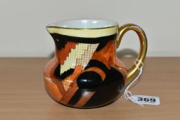 A CARLTON WARE 'JAZZ STITCH' PATTERN MILK JUG, decorated with orange, yellow and black geometric