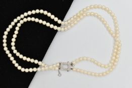 A DOUBLE STRAND OF CULTURED PEARLS WITH DIAMOND CLASP, round white cultured pearls with pink