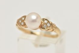 A 9CT GOLD CULTURED PEARL AND DIAMOND RING, set with a single cultured white pearl, measuring