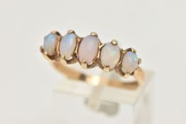 A 9CT GOLD OPAL RING, designed with a row of five oval cut opal cabochons, each in a two claw