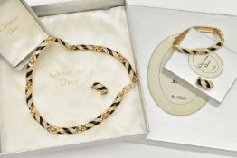A THREE PIECE 'CHRISTIAN DIOR' SET, to include a necklace, bracelet and clip on earrings, gold