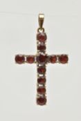 A 9CT GOLD GARNET SET CROSS PENDANT, set with circular cut garnets, fitted with a tapered bail,