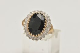 A LARGE 9CT GOLD SAPPHIRE AND DIAMOND CLUSTER RING, of an oval form, set with a central oval cut
