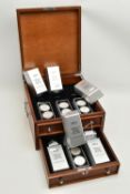 A CASED DISPLAY OF USA SILVER DOLLAR COINS, to include Eagle Silver dollar coins in individual boxes