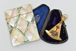 A MASONIC PENDANT AND CARD CASE, a gilt Rose Croix masters jewel, depicting a pelican feeding her
