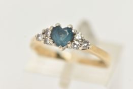 A 9CT GOLD BLUE SPINEL AND DIAMOND RING, set with a central heart cut blue spinel in a three claw