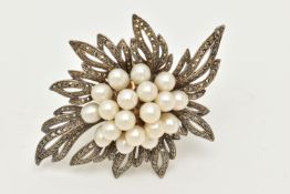 A LARGE WHITE METAL MARCASITE AND IMITATION BROOCH/PENDANT, of a spray design, unmarked, fitted with