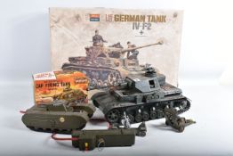 A SELECTION OF MILITARY TOYS, to include a boxed camouflaged battery operated Cap Firing Tank by