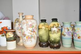 A GROUP OF ELEVEN VASES, comprising a Royal Doulton cylindrical vase D4585 decorated with a