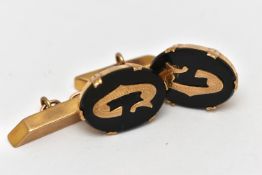 A PAIR OF 9CT GOLD AND ONYX CUFFLINKS, each designed with an oval onyx panel in a double six claw