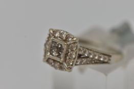 A 9CT GOLD DIAMOND CLUSTER RING, square form ring set with four princess cut diamonds in an