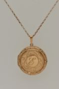 A 9CT GOLD LOCKET PENDANT, a circular form pendant with scrolling detail, letter E engraving to