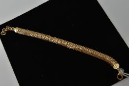 A 9CT GOLD BRACELET, a mesh style bracelet, fitted with a lobster clasp and extender chain,