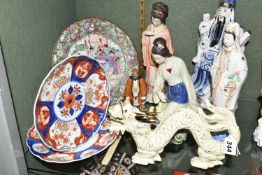A GROUP OF ORIENTAL/ORIENTAL THEMED CERAMICS, comprising a pale yellow glazed figure of a Chinese