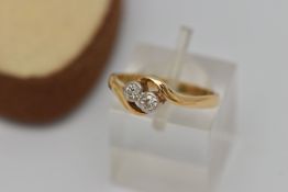 A DIAMOND CROSSOVER RING, designed as two old cut diamonds in millegrain setting to the crossover