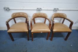 A SET OF THREE REPRODUCTION TANNED LEATHER ARMCHAIRS, with buttoned back rest and open armrests,