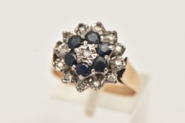 A 9CT GOLD SAPPHIRE AND DIAMOND CLUSTER RING, raised cluster set with a central illusion set