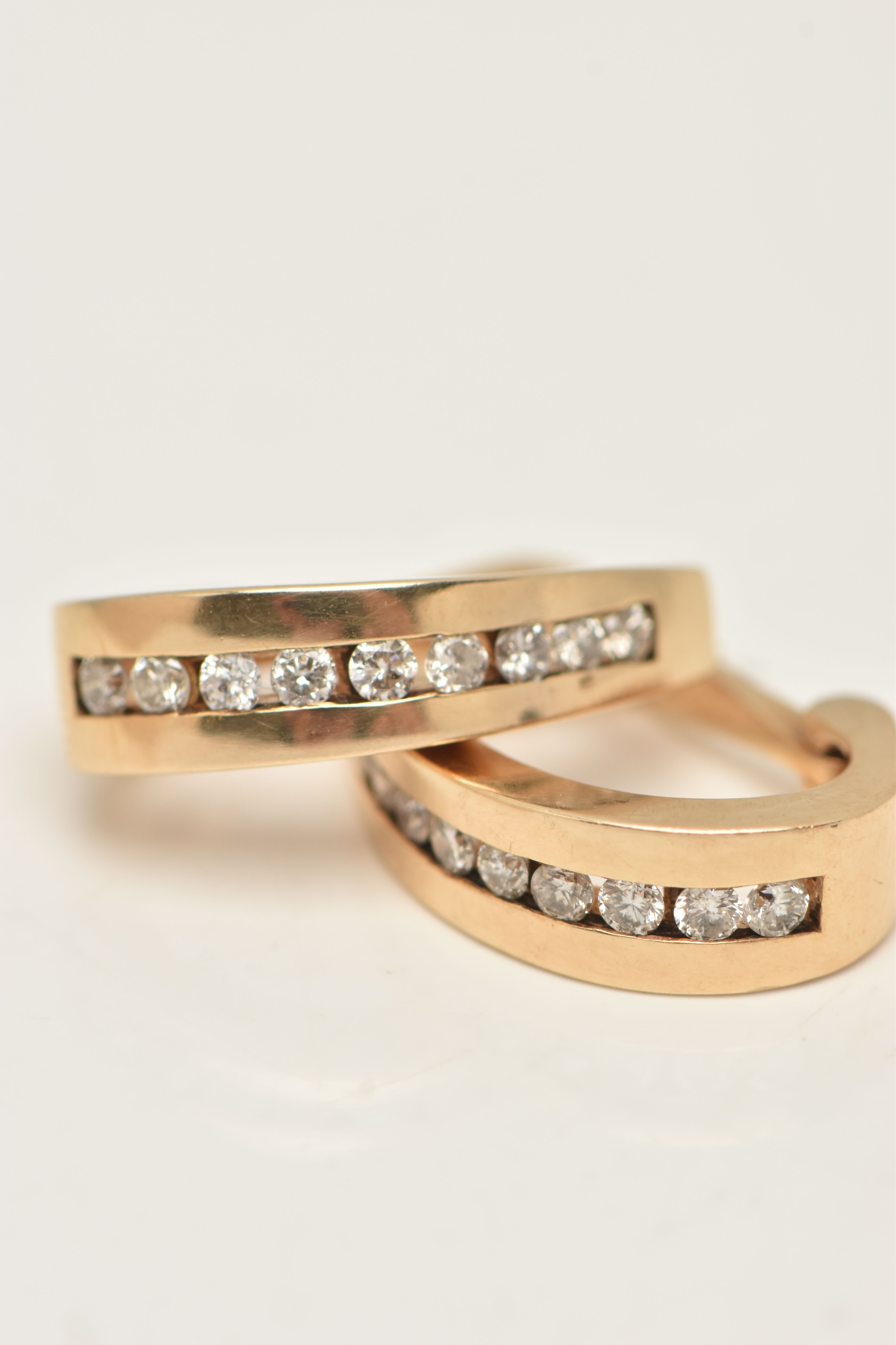 A PAIR OF 9CT GOLD DIAMOND HOOP EARRINGS, yellow gold half hoop, channel set with round brilliant - Image 4 of 5