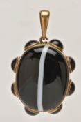 A LARGE BANDED AGATE MOURNING PENDANT, a large brown and white banded agate oval cabochon, collet