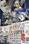 A PLASTIC STORAGE TUB AND CARDBOARD BOX CONTAINING MIXED COINS, to include an album of 1st Day