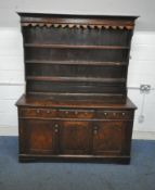 A GEORGAIN OAK DRESSER, the three tier plate rack, atop a base that's fitted with three drawers,