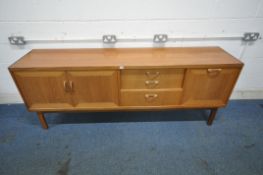 G PLAN, A MID CENTURY TEAK SIDEBOARD, fitted with double cupboard doors, three drawers, and a fall