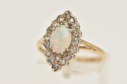 A 9CT GOLD OPAL AND DIAMOND CLUSTER RING, of a marquise form, set to the centre with an oval cut
