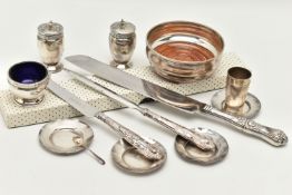 A BOX OF SILVER ITEMS, to include a pair of pepperettes, polished urn form with Celtic pattern