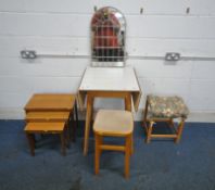 A FORMICA DROP LEAF TABLE, two stools, a wall mirror and a nest of three tables (condition report: