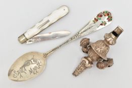 THREE ITEMS OF SILVER, to include a late Victorian silver rattle, an early 20th century mother of