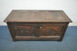 A GEORGIAN OAK BLANKET CHEST, with carved panels and decoration, width 131cm x depth 55cm x height