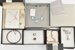 AN ASSORTMENT OF JEWELLERY, to include two silver and gold plated 'Waterford' necklaces, fitted with