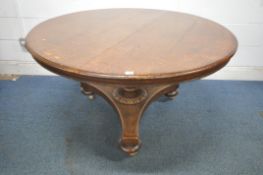 A REGENCY STYLE OAK CIRCULAR BREAKFAST TABLE, raised on a turned support, a tri-form base, bun