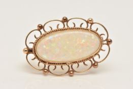 A 9CT GOLD SYNTHECTIC OPAL BROOCH, of an oval form, set with a synthetic opal cabochon, milgrain